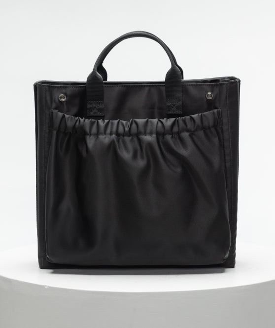 Removable tote with elastic organizer pocket